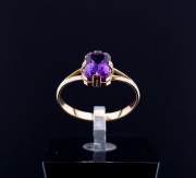 Gold ring with colored stone