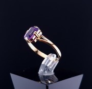 Gold ring with colored stone