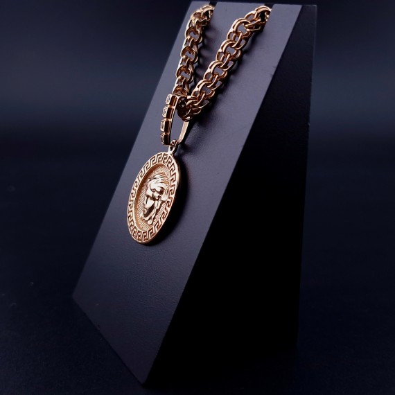 Gold pendant with zircons