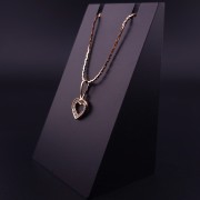 Gold pendant with zircons