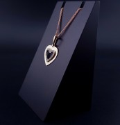 Gold pendant with zircons