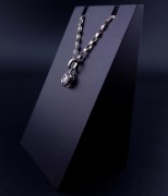Gold pendant with zircon