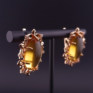 Gold earrings with citrines and fianites
