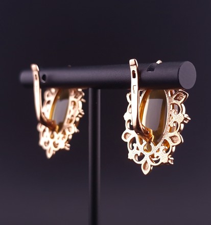 Gold earrings with citrines and fianites