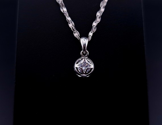 Gold pendant with zircon